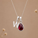 Sterling silver initial W necklace with a natural January garnet