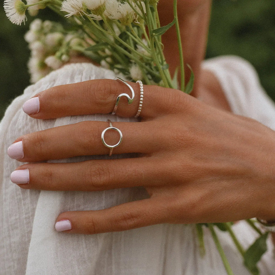 woman wearing three sterling silver rings - silver wave ring Australia 