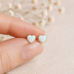 sterling silver stud earring with lab-grown white opal hearts held