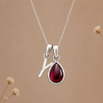 Sterling silver initial Y necklace with a natural January garnet