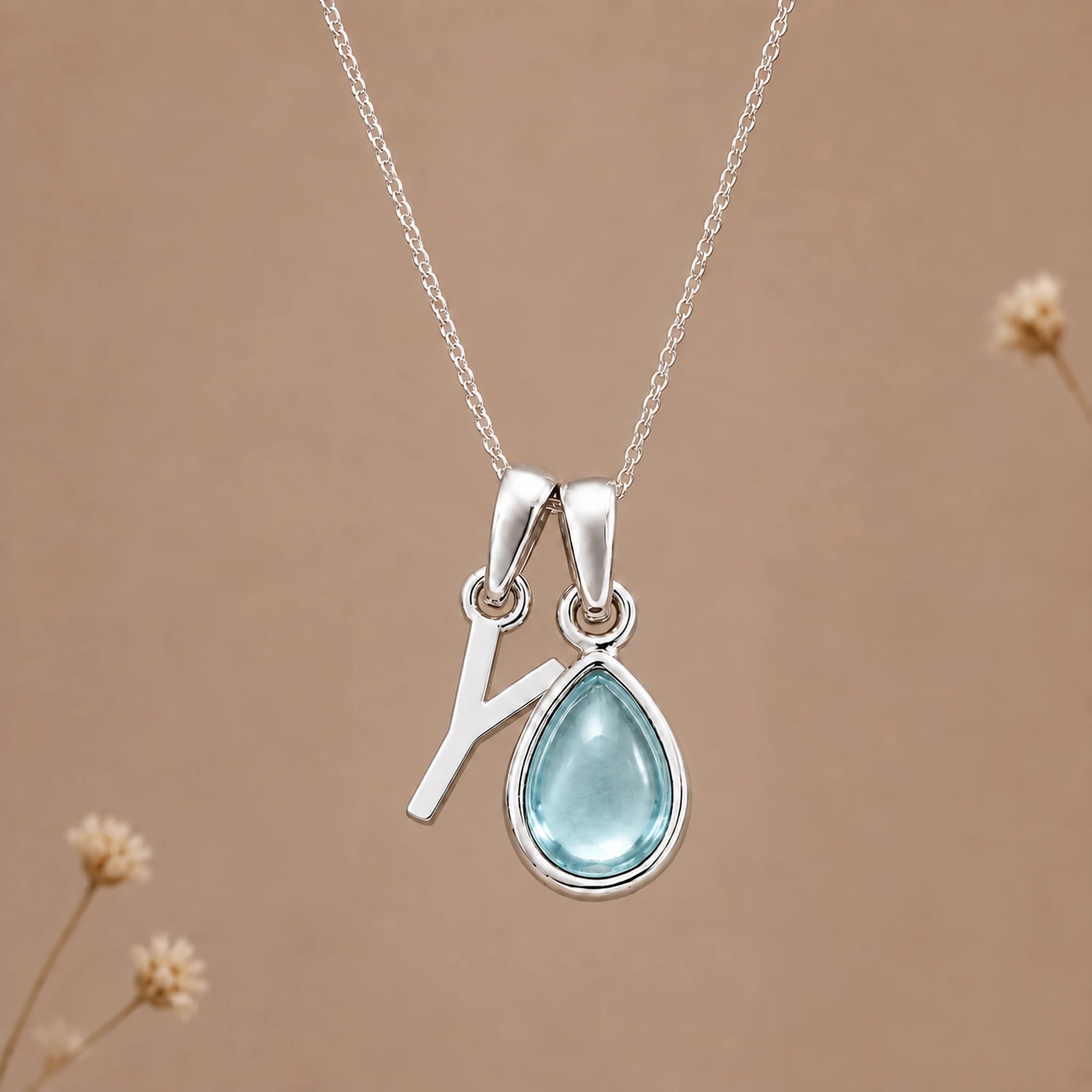 Sterling silver Y initial necklace with pale blue March aquamarine in a polished teardrop bezel