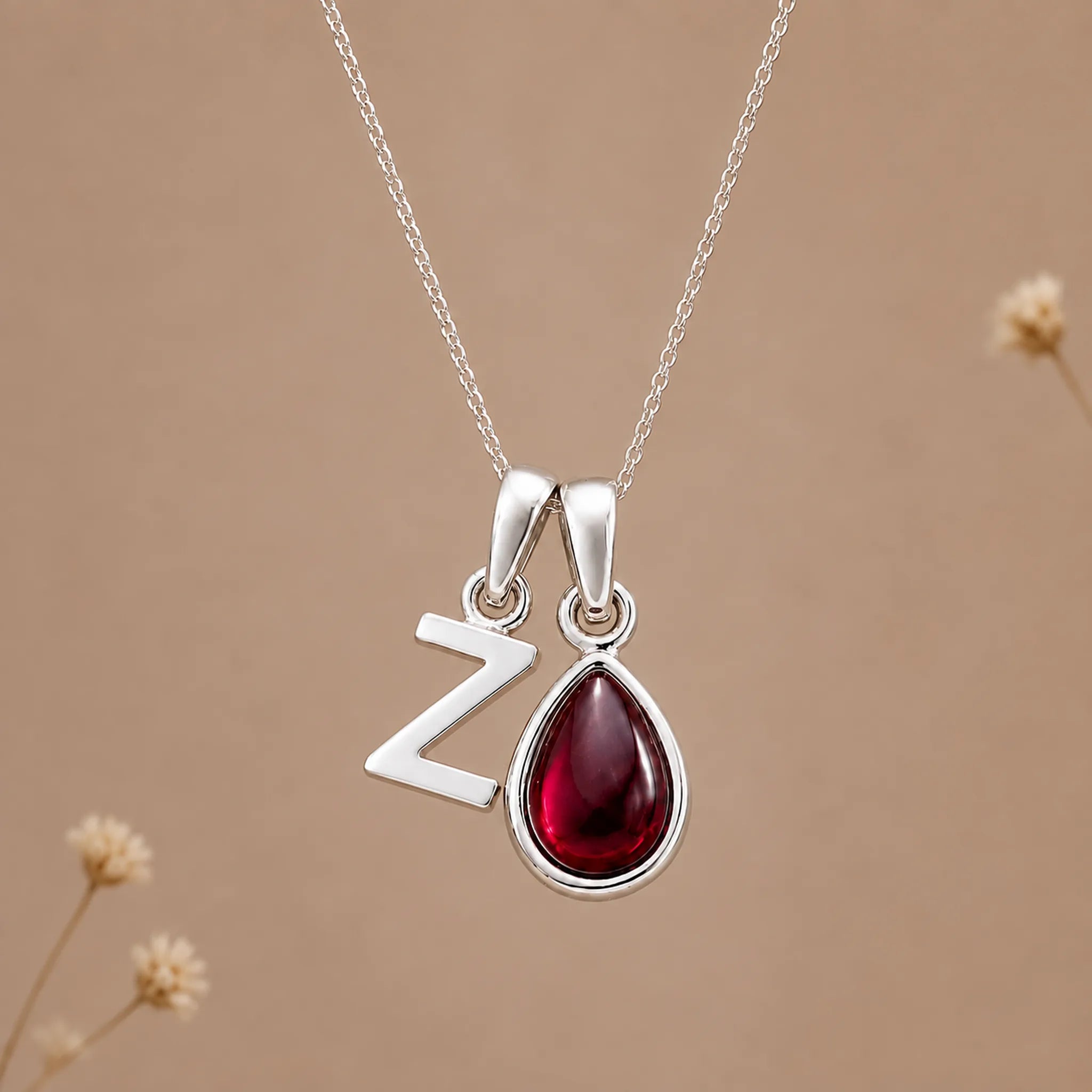 Sterling silver initial Z necklace with a natural January garnet