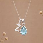 Sterling silver Z initial necklace with pale blue March aquamarine in a polished teardrop bezel
