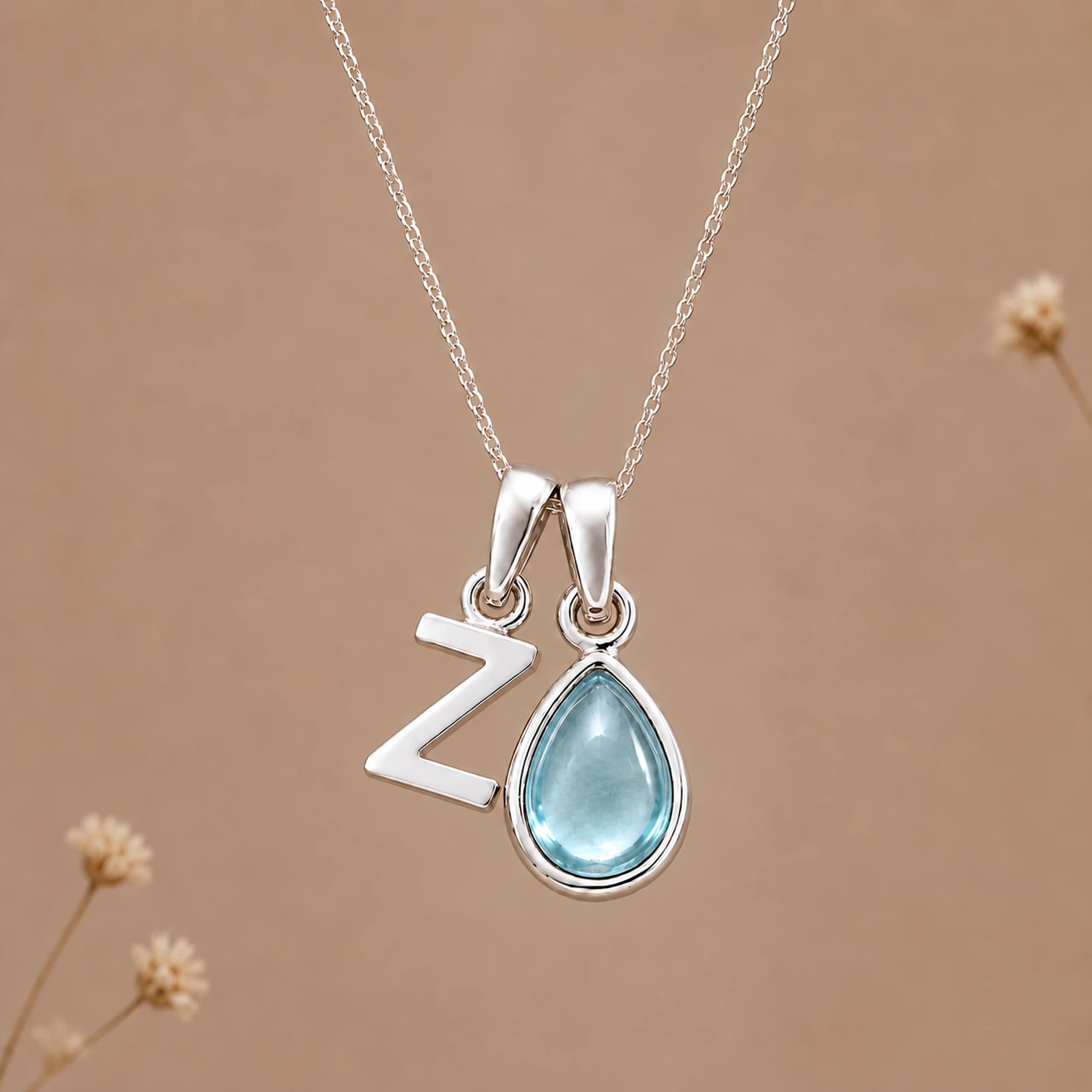Sterling silver Z initial necklace with pale blue March aquamarine in a polished teardrop bezel