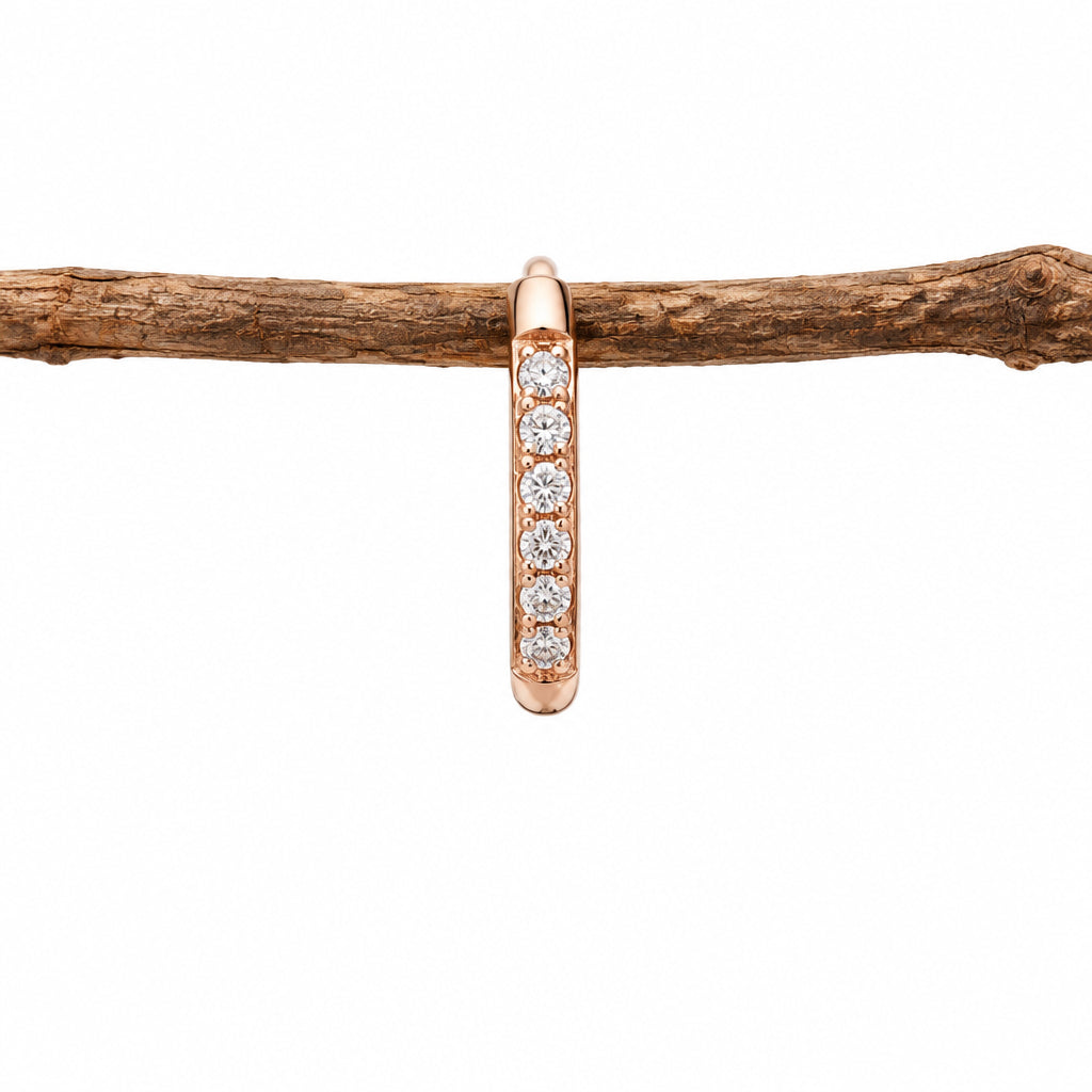 Single rose gold waterproof pavé huggie hoop earring, side view