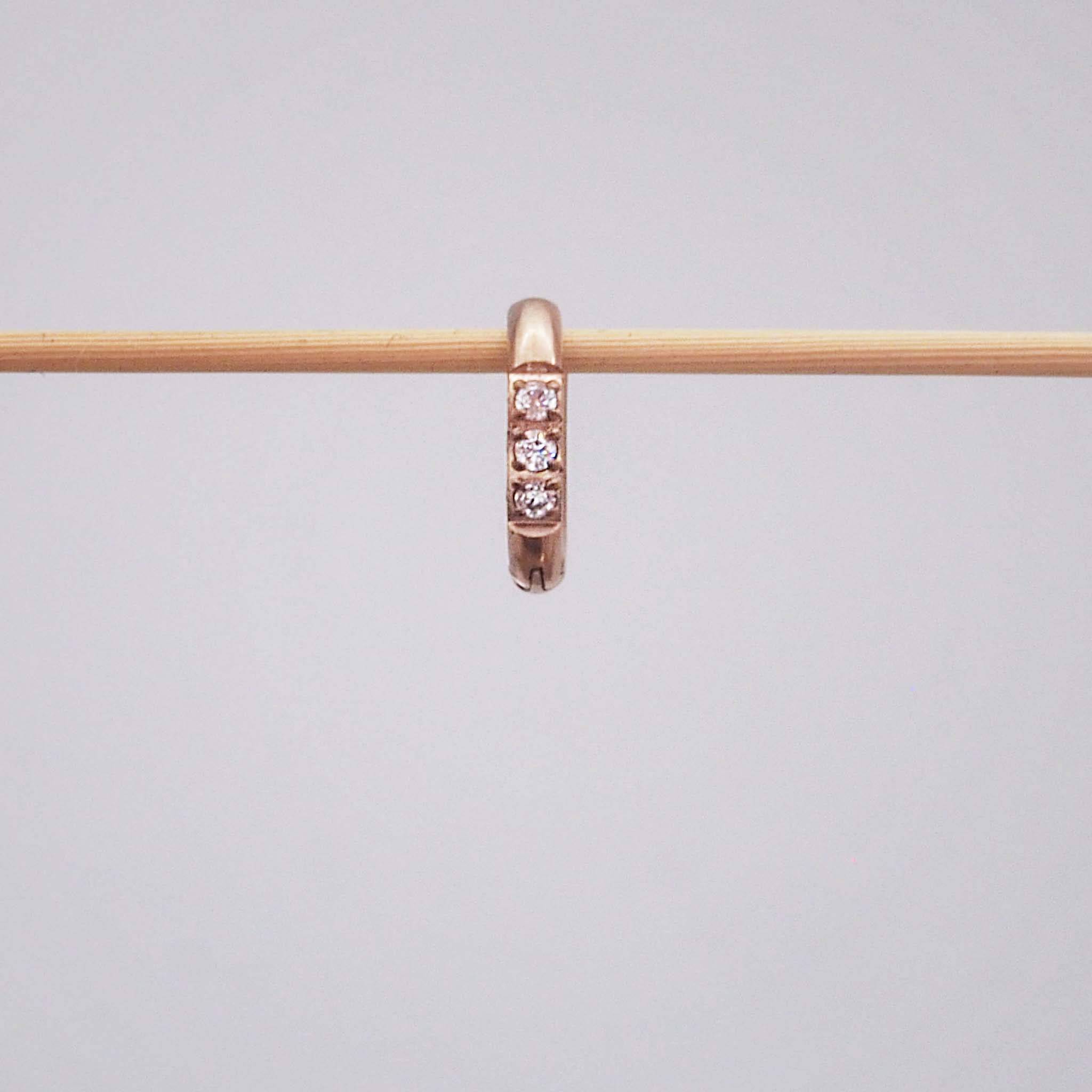 Single waterproof stainless steel pavé rose gold huggie earring