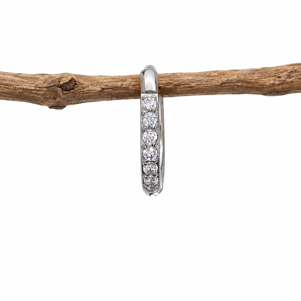 Single silver waterproof pavé huggie hoop earring, side view