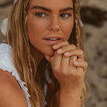 Woman wearing the solid 9k gold wave ring