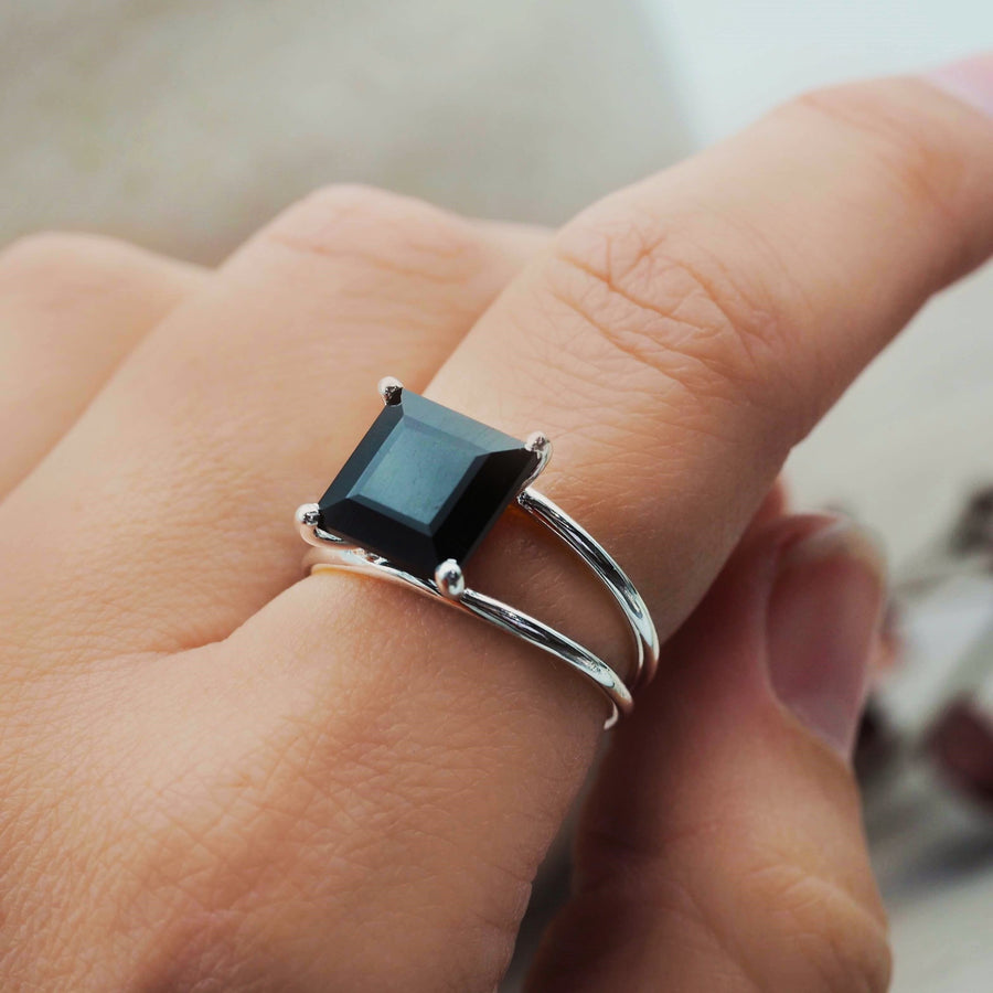 index finger wearing statement sterling silver square black onyx ring