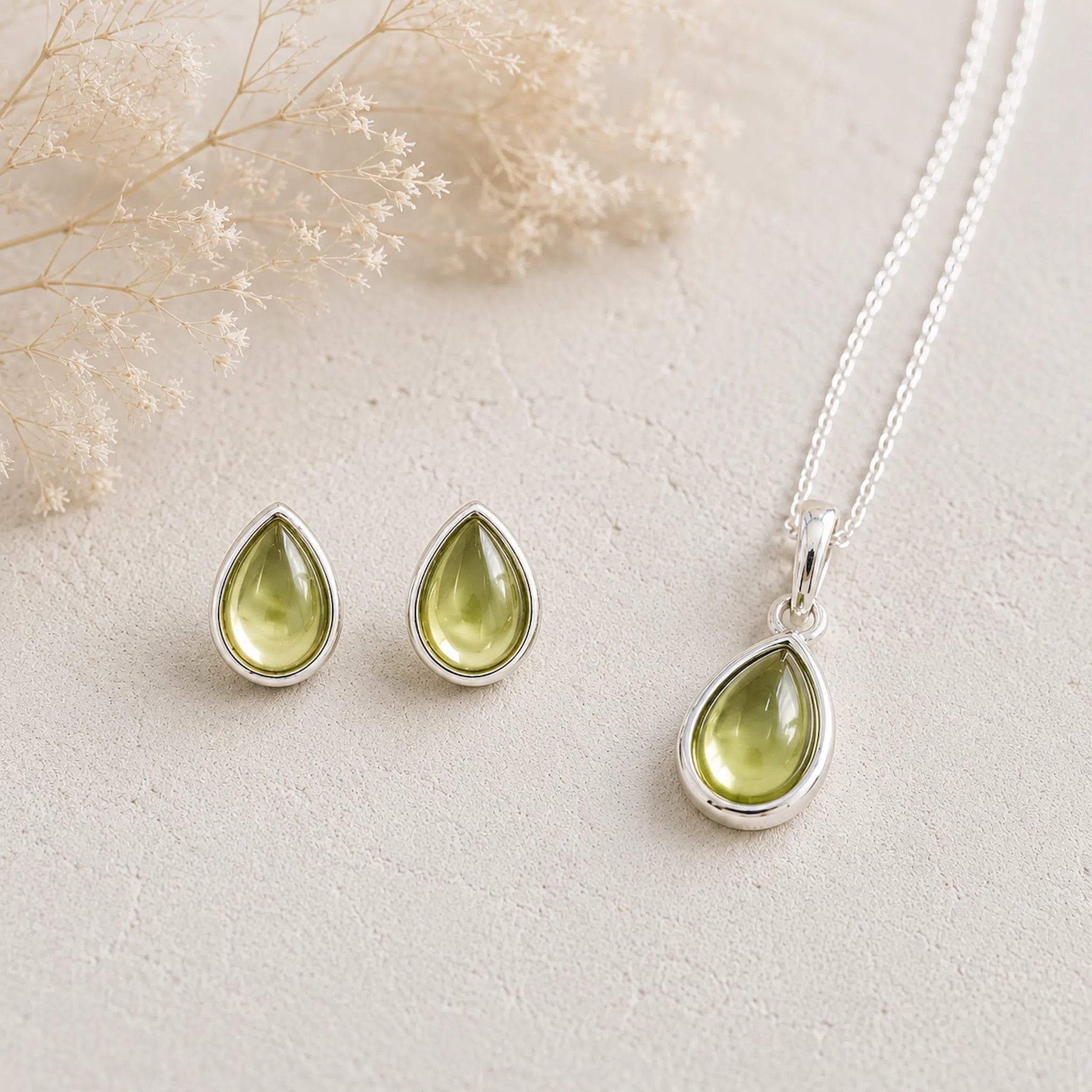 Sterling Silver August Birthstone Peridot Jewellery Set featuring natural peridot earrings and matching peridot necklace.