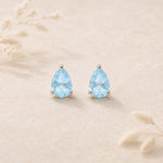 sterling silver facted claw-set pear-shaped natural blue topaz stud earrings