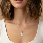 Sterling Silver Chain Necklace with a cancer zodiac pendant worn by a person against a neutral background
