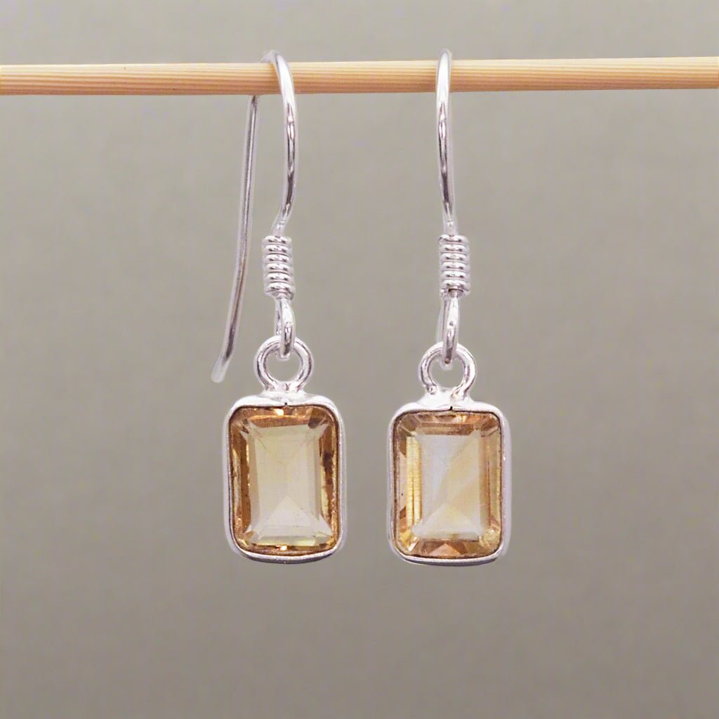 sterling silver french hook earrings with bezel-set and emerald-cut natural citrine gemstones hanging