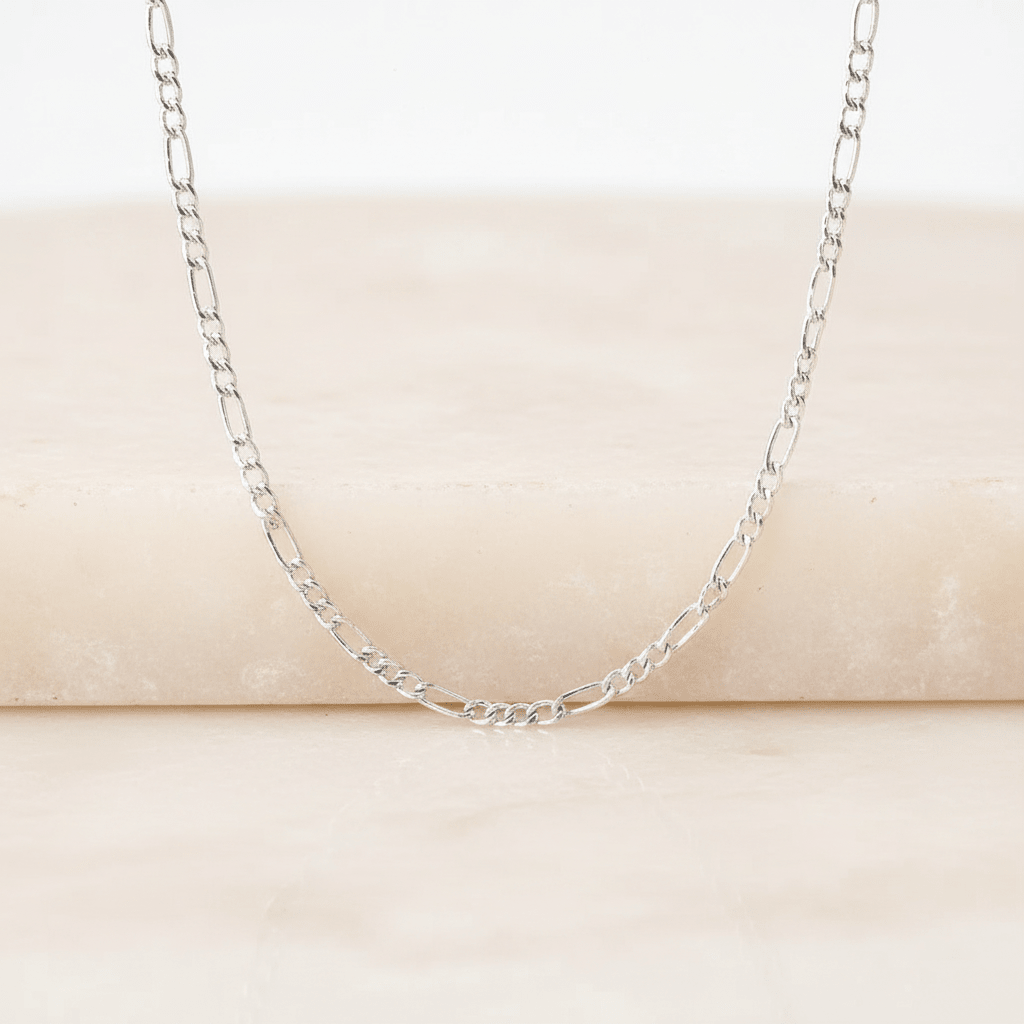 sterling silver chain hanging against a light background