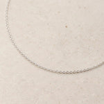close up of a sterling silver fine cable chain necklace