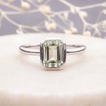 sterling Silver ring with a faceted natural green amethyst gemstone on a soft background