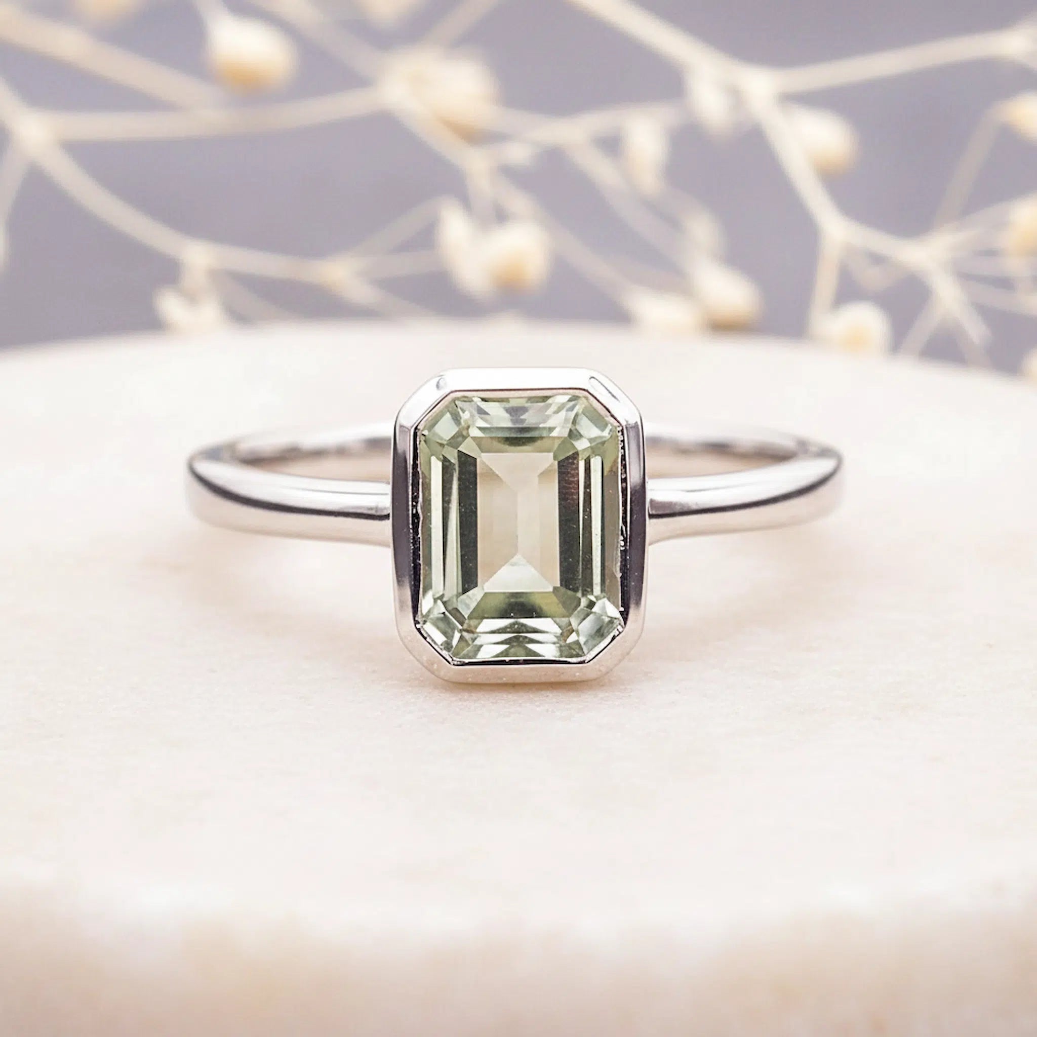 sterling Silver ring with a faceted natural green amethyst gemstone on a soft background