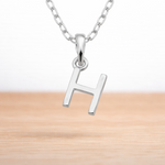 Sterling Silver necklace with a 'H' initial pendant on a white background