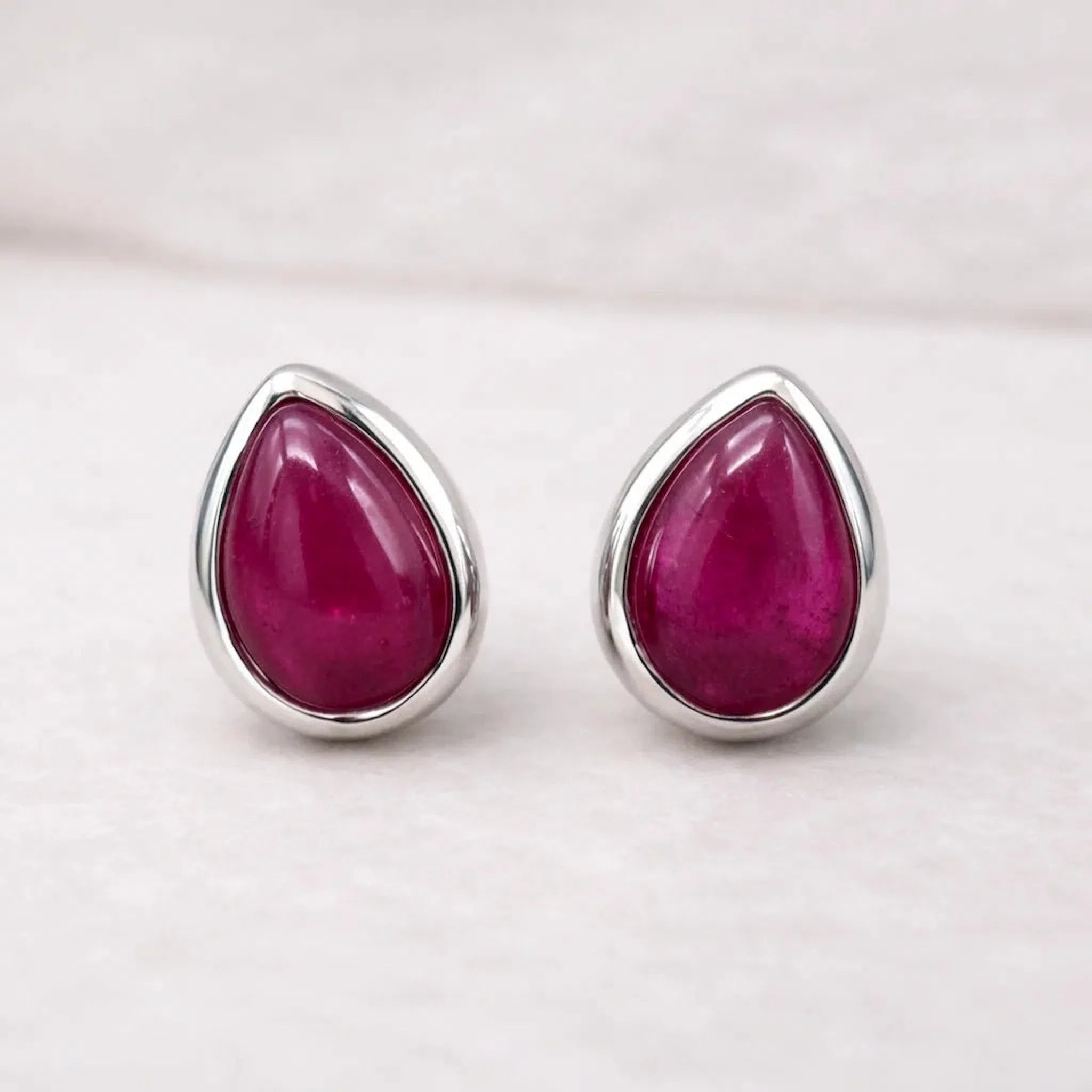 Sterling silver July Birthstone stud earrings with pear-shaped natural ruby gemstones