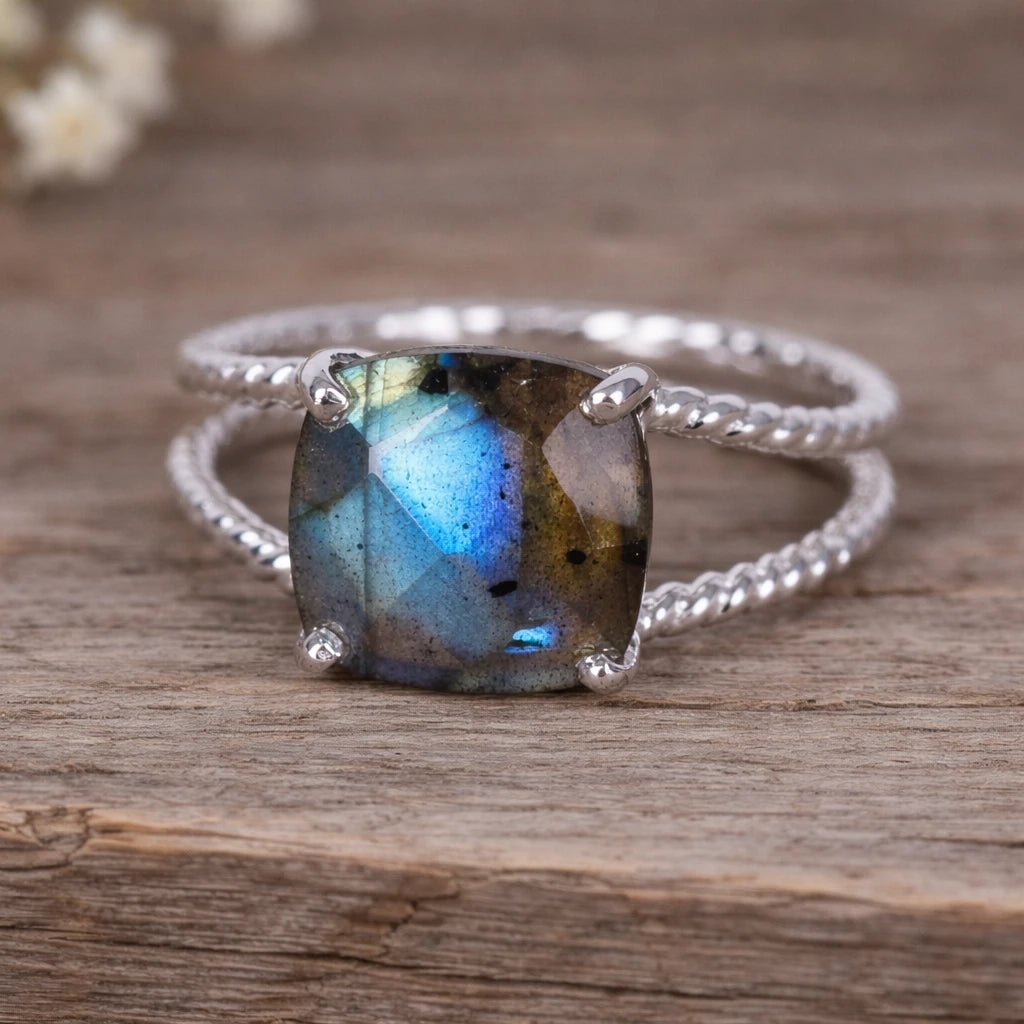 Sterling Silver ring with a natural Labradorite gemstone on a wooden surface