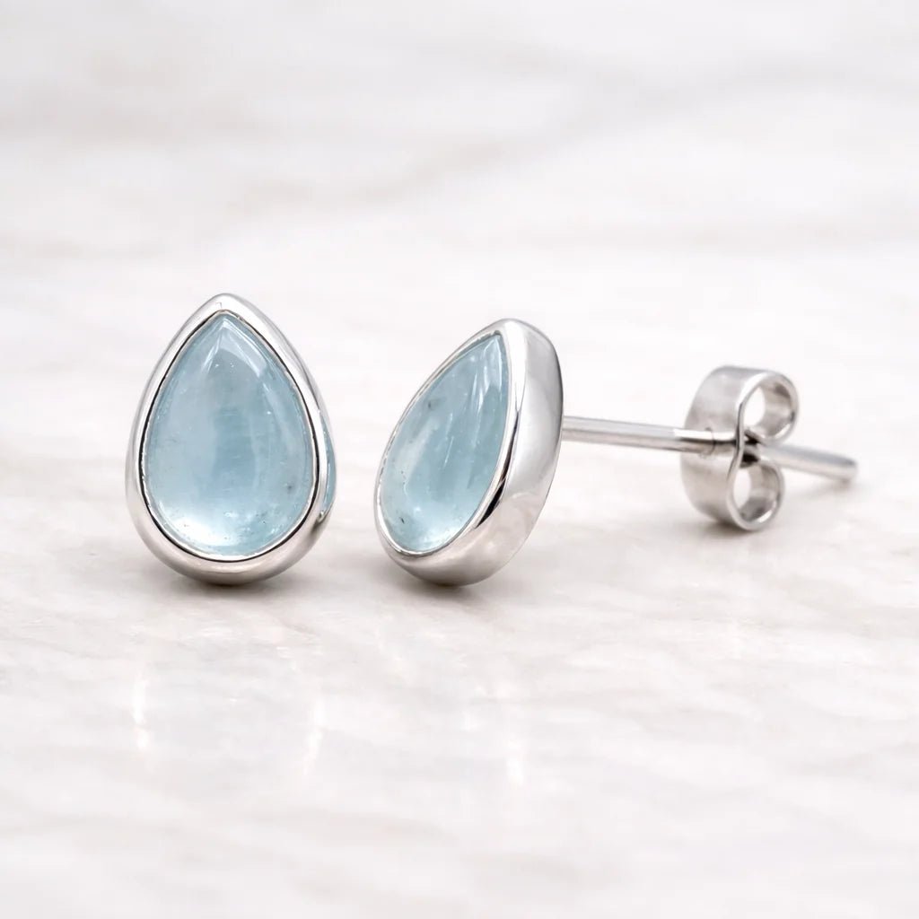 sterling silver Teardrop-shaped natural aquamarine earrings on a white background
