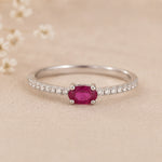 sterling Silver ring with a red ruby gemstone on a beige background