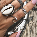 sterling silver wave ring and Cowrie Shell Ring being worn