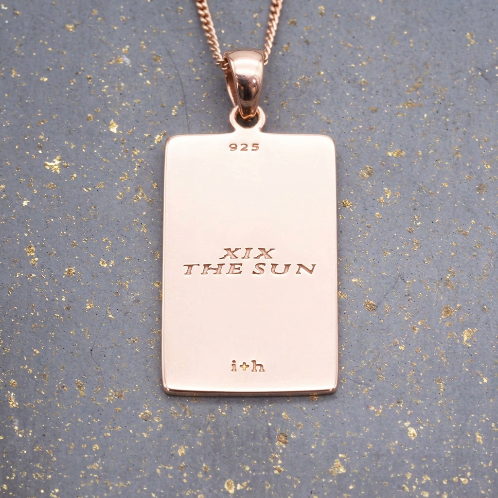 Back of the sun tarot card necklace on rose gold