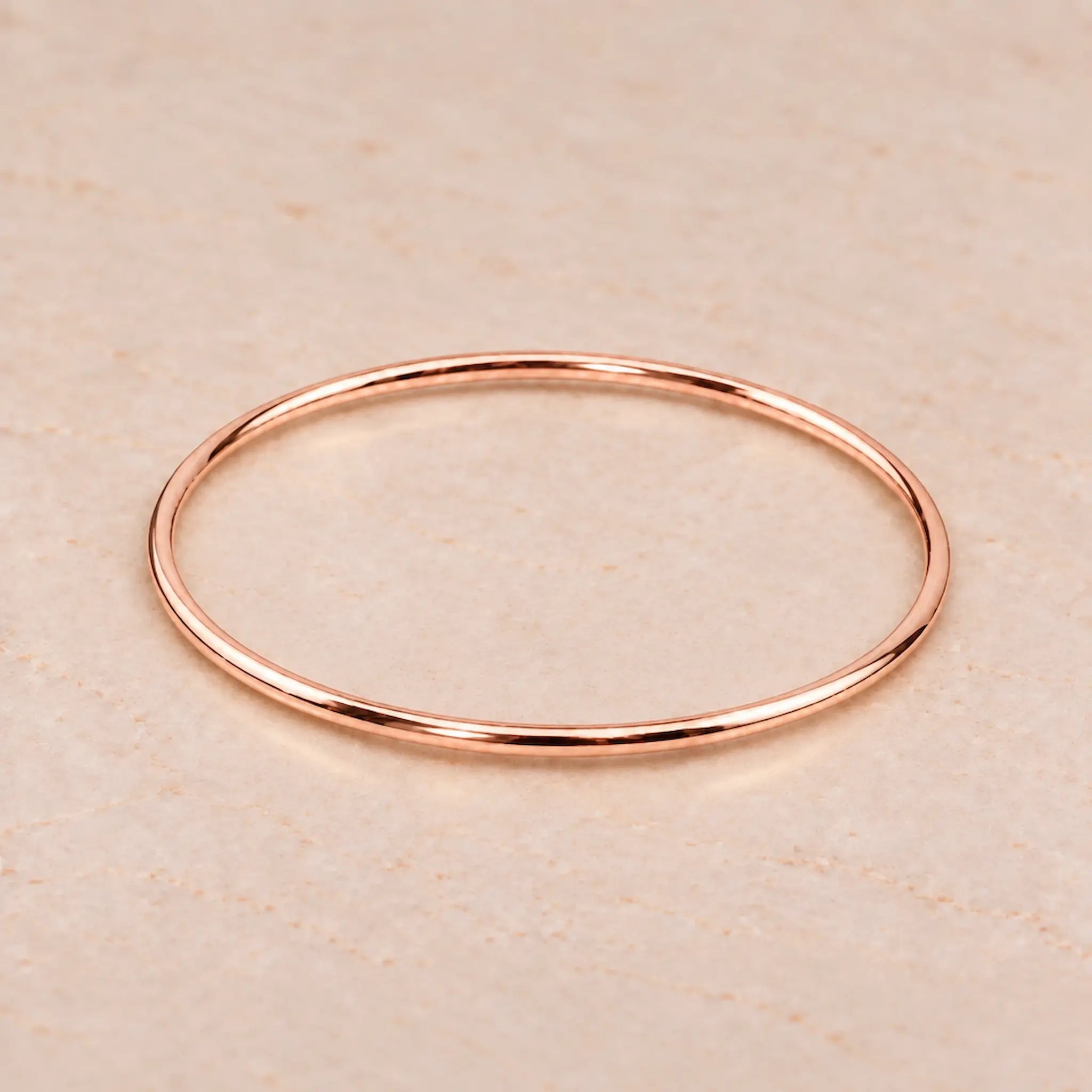 Thin 3mm rose gold bangle bracelet in PVD plated waterproof stainless steel
