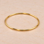 Thin 3mm gold bangle bracelet in PVD plated waterproof stainless steel