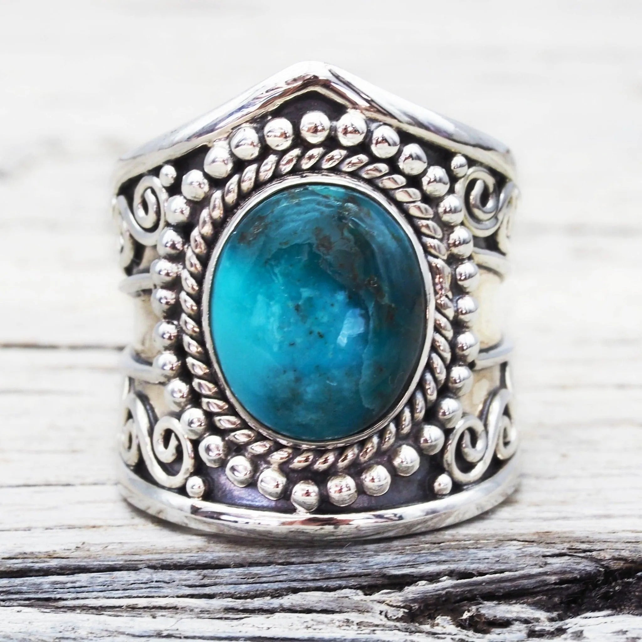 sterling Silver statement turquoise ring on a textured surface