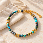 Turquoise and labradorite gold bracelet styled with pouch and extender chain