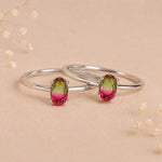 two sterling silver oval watermelon tourmaline ring with green and pink colours on a light background
