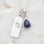 sterling Silver necklace with virgo zodiac sign and September birthstone sapphire gemstone on a light background