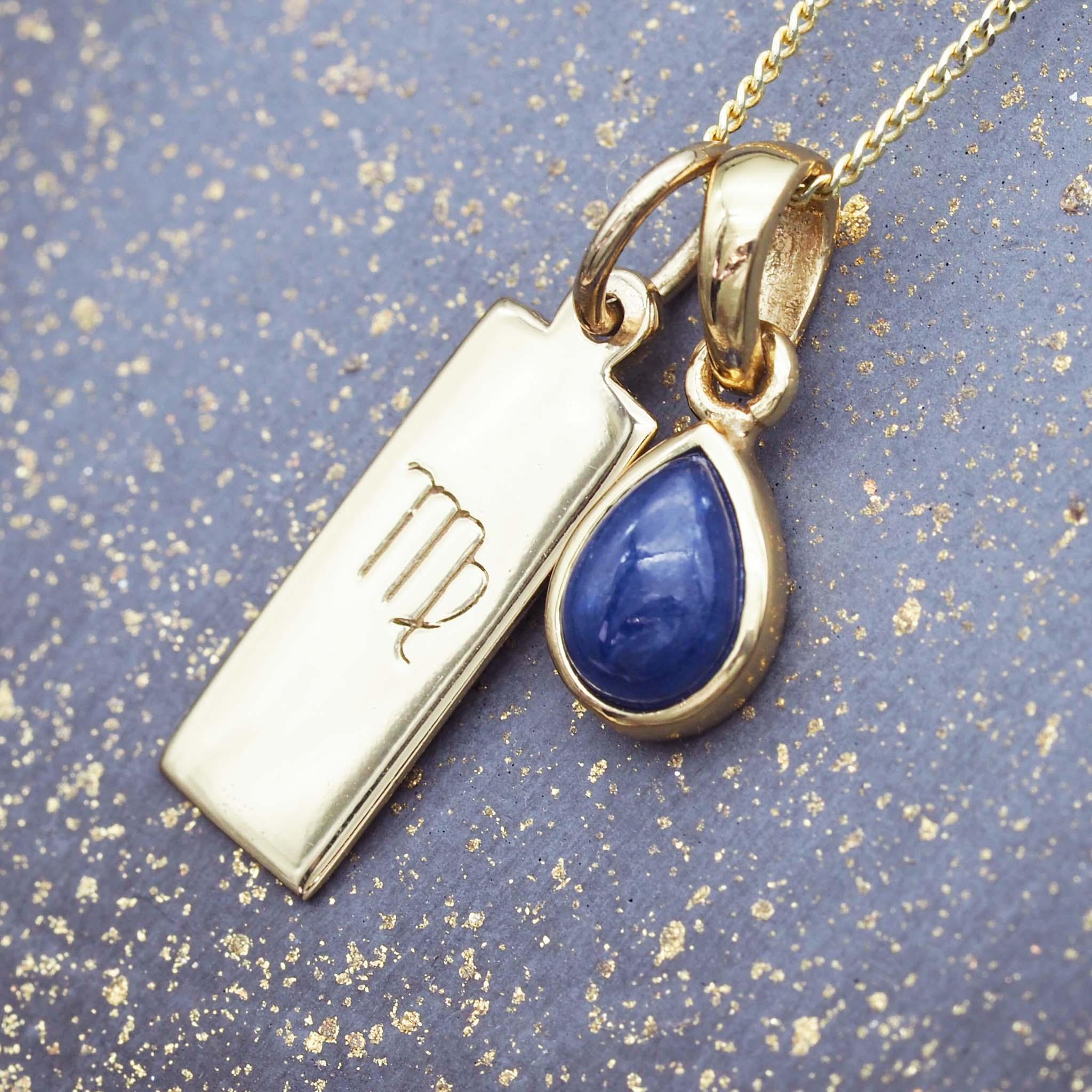 Gold Virgo star sign necklace with a deep blue genuine sapphire July birthstone charm by indie and harper