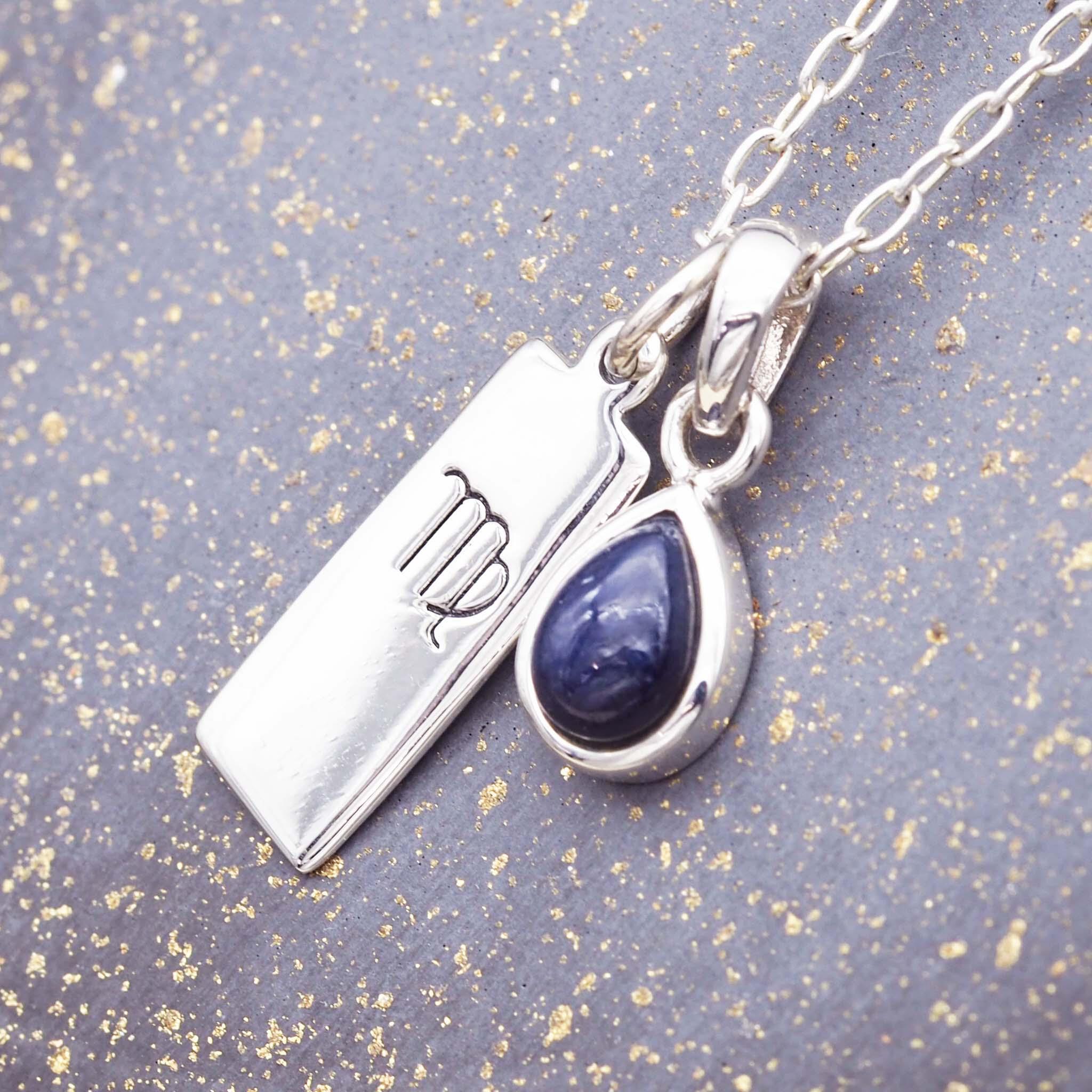 Sterling silver Virgo star sign necklace with a deep blue genuine sapphire July birthstone charm by indie and harper