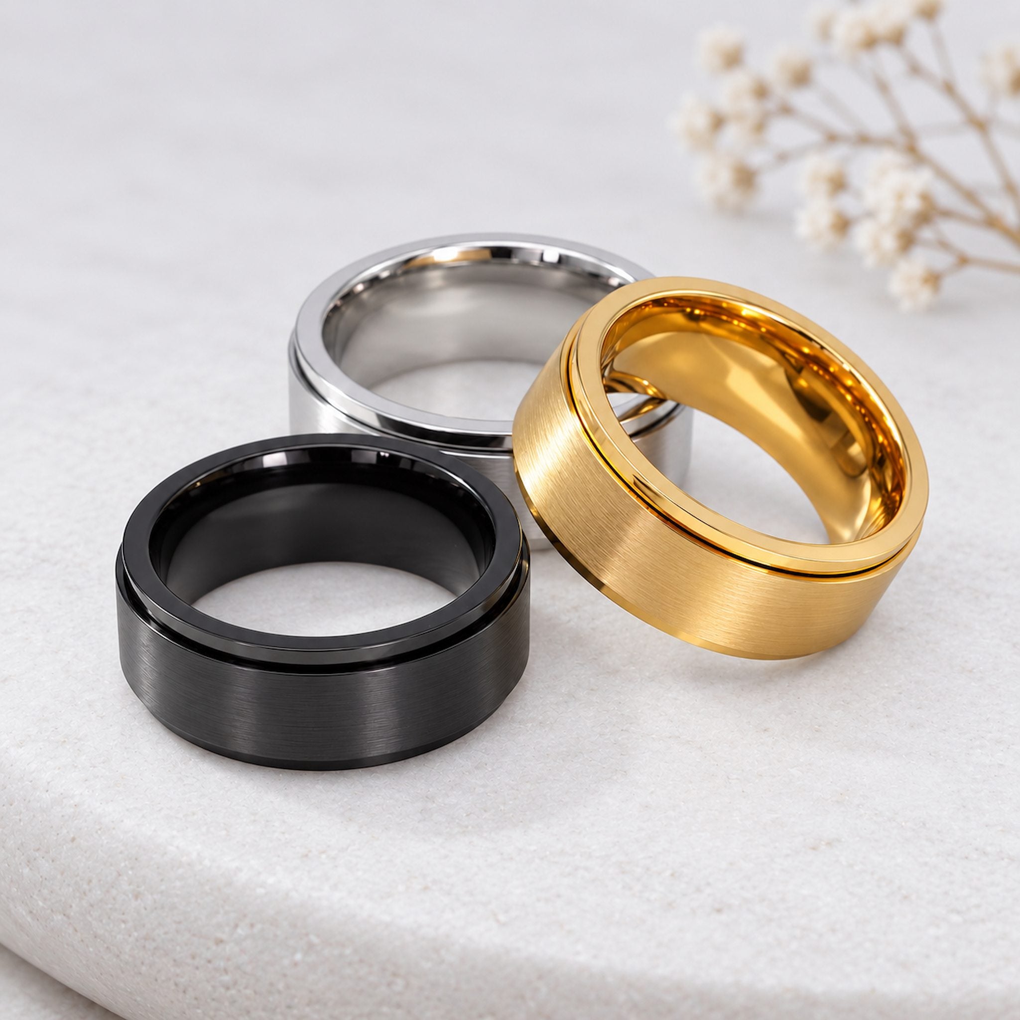 Stainless Steel Waterproof Spinner Rings in classic Silver, Gold and Black Minimalist Band styles.