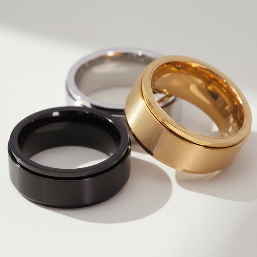 Stainless Steel Waterproof Spinner Rings in classic Silver, Gold and Black Minimalist Band styles.