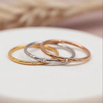 minimalist waterproof stacker rings in gold, silver and rose gold and cubic zirconias