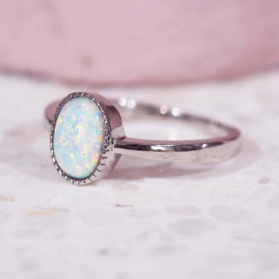 white opal ring made with sterling silver with pink background - womens jewellery by indie and harper