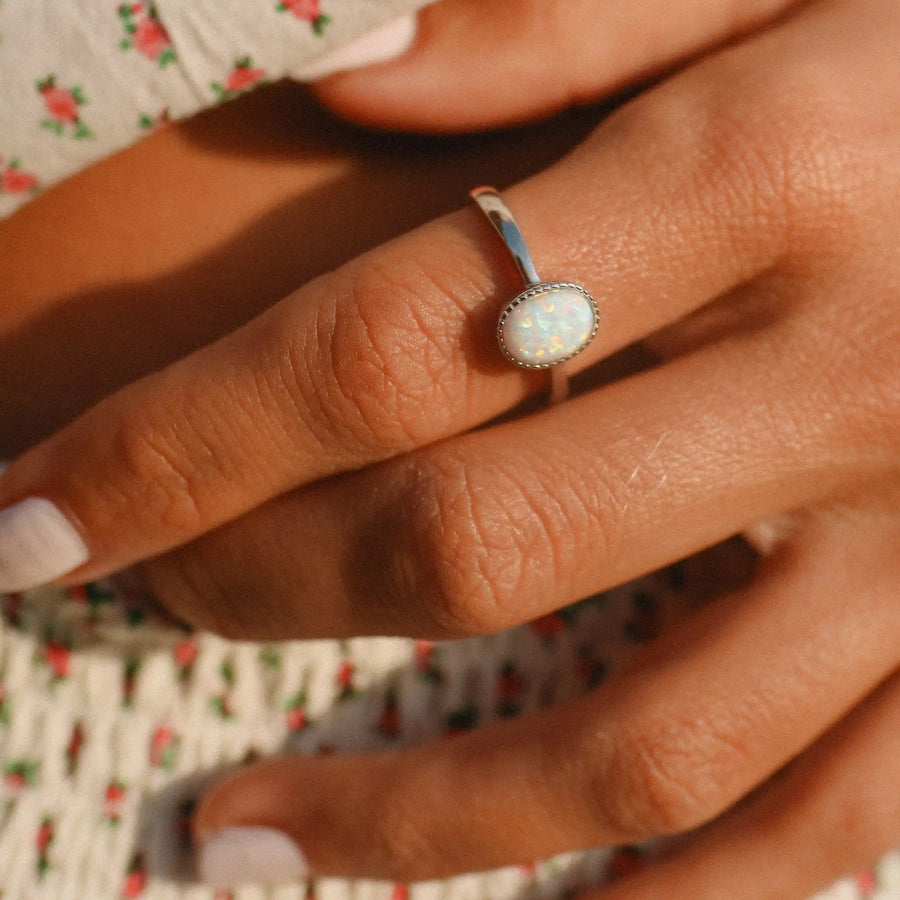 woman wearing sterling silver oval opal ring