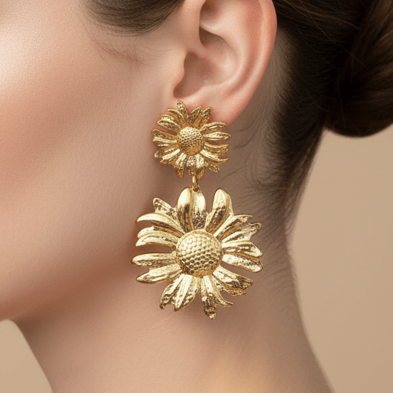 Gold sunflower statement earrings being worn 