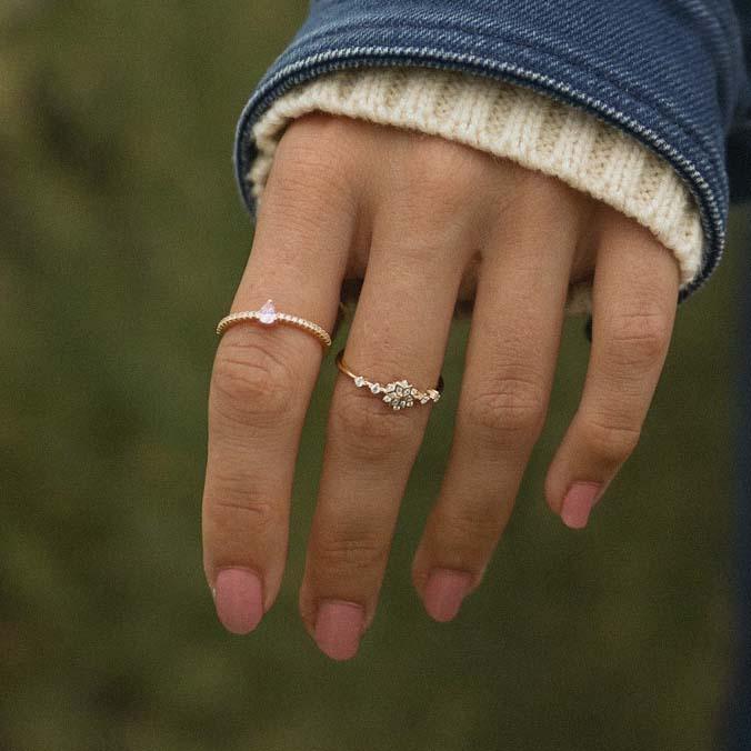 Dainty gold rings being worn - promise rings and gold jewellery by australian jewellery brands online indie and Harper