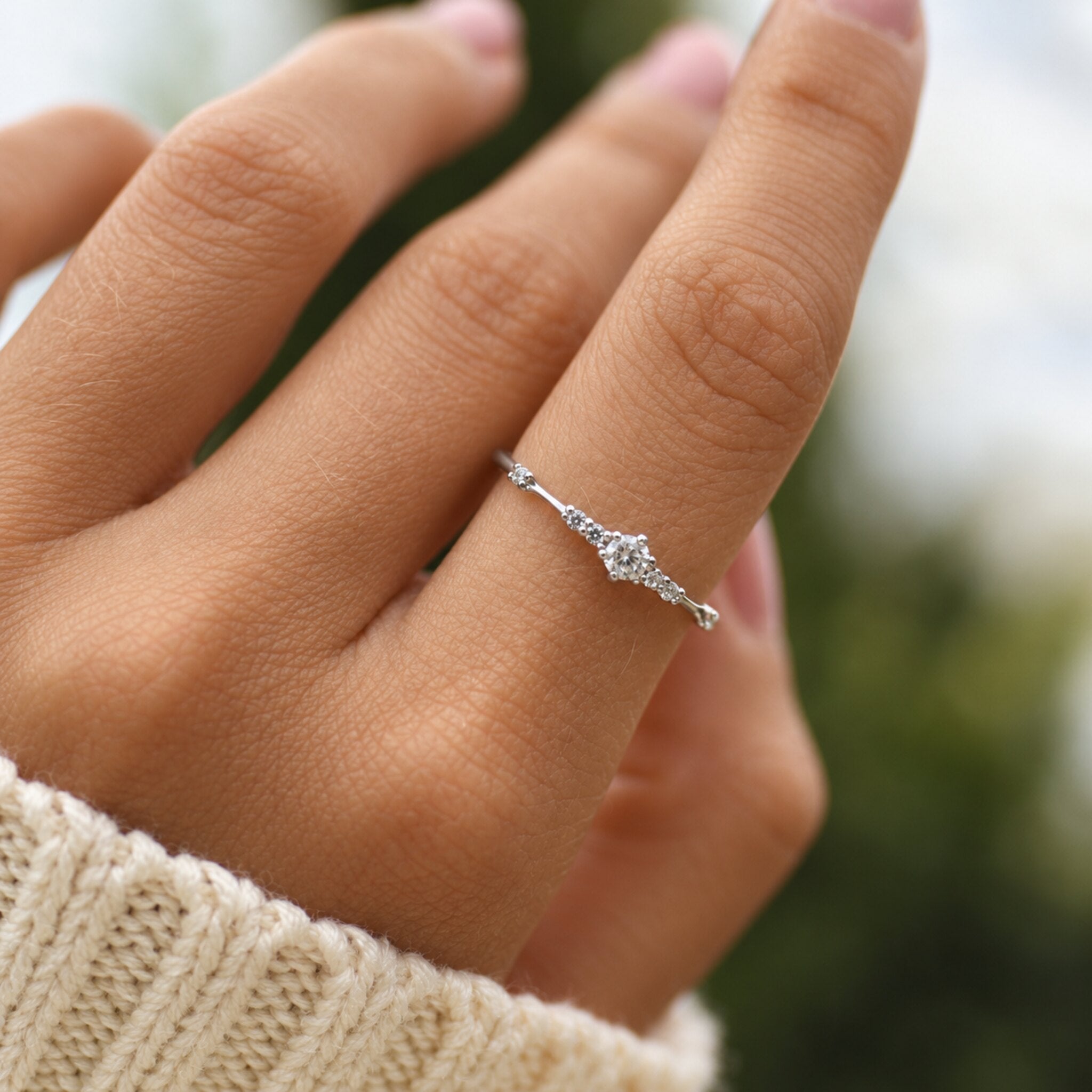 Dainty Sterling Silver Ring with cubic zirconias being worn