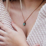 woman wearing Copper and Raw Emerald Necklace by australian jewellery brands indie and harper