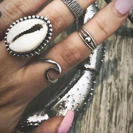 Hand wearing Cowrie Sea Shell Ring and sterling silver wave ring - womens sterling silver jewellery Australia