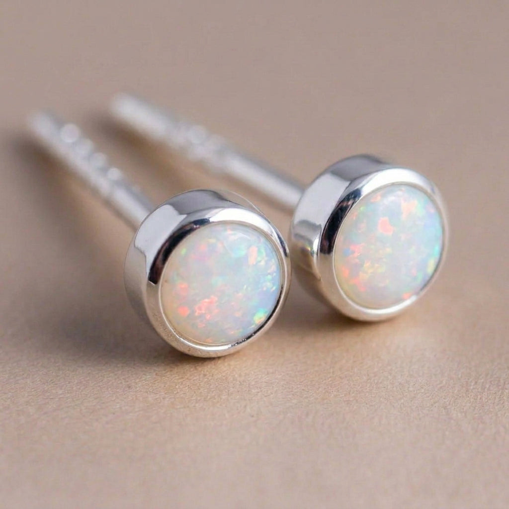 Sterling silver Australian opal studs showing the opal colour play