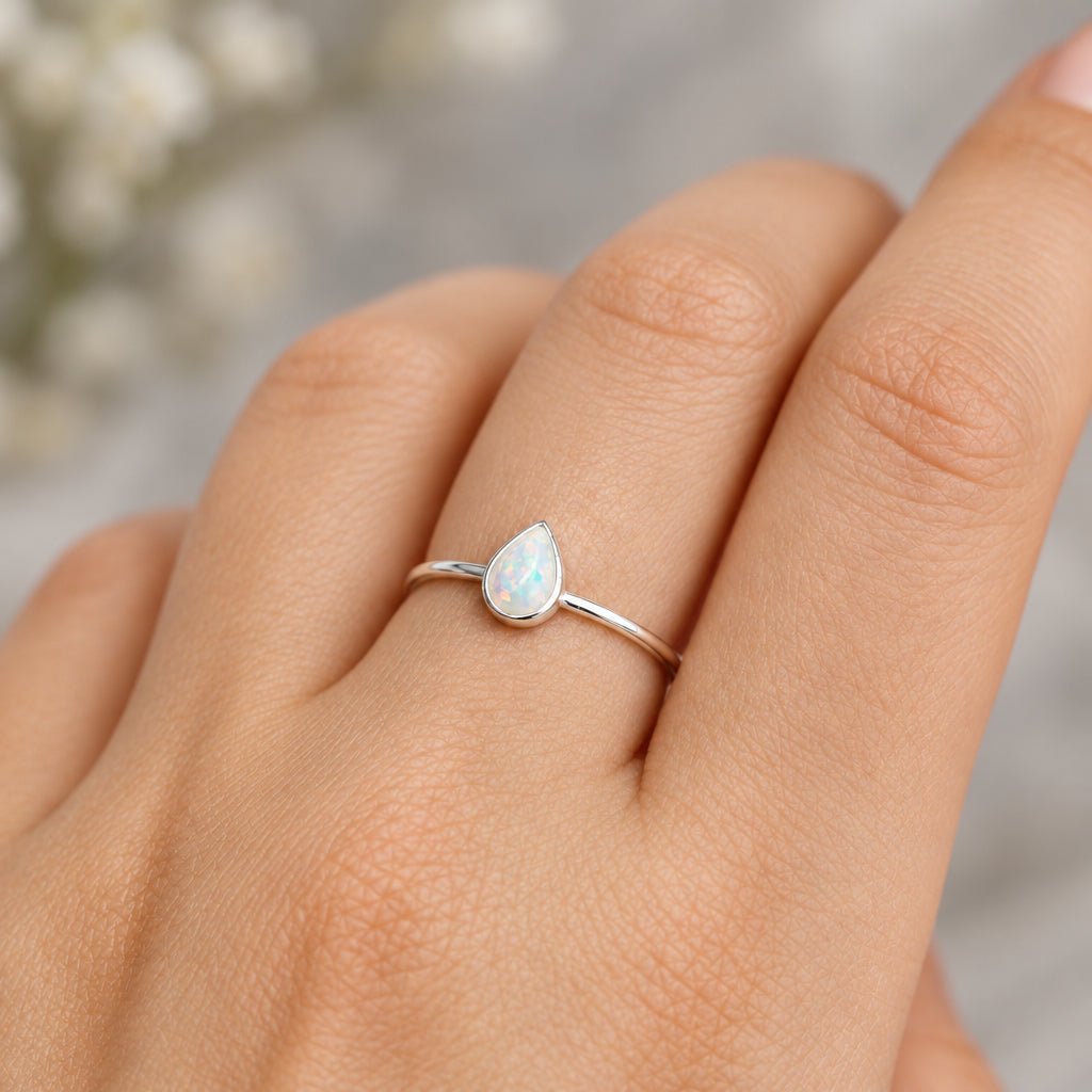 Hand wearing the sterling silver white opal ring from the set