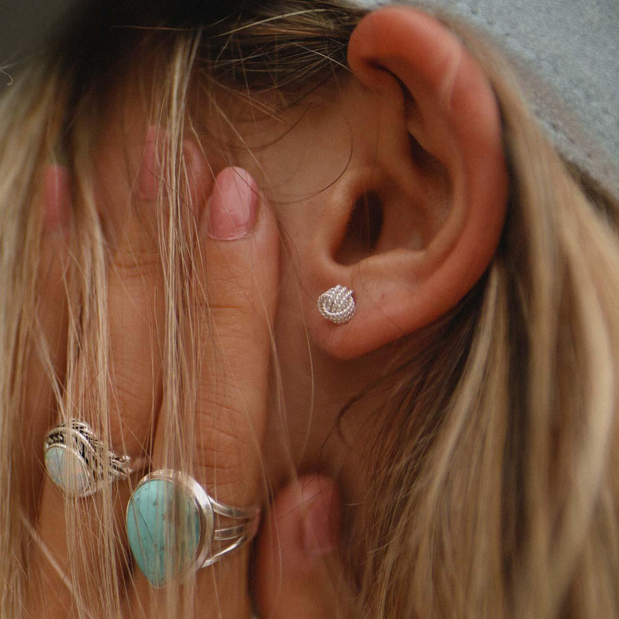 Woman wearing Dainty Knot Earrings - sterling silver earrings - Australian jewellery online 