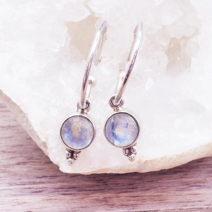 Dainty Moonstone earrings sitting in a crystal  - womens moonstone jewellery